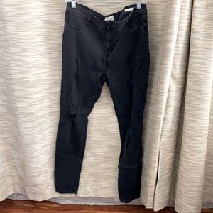 Black jeans with little rips in the thigh